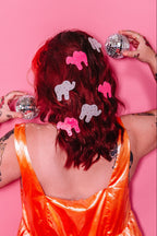 "Animal Cracker Hair Clip Set" features two clips (one pink camel, one white elephant) The "sprinkles" are made with multi color gemstones! Each clip measures 6 cm.