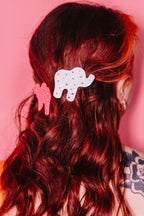 "Animal Cracker Hair Clip Set" features two clips (one pink camel, one white elephant) The "sprinkles" are made with multi color gemstones! Each clip measures 6 cm.