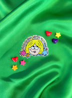 A vinyl sticker with glitter detail, featuring an illustration of a character with blonde hair, and the text 'Abortion bans are so yesterday’. - The Peach Fuzz