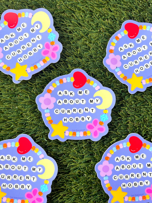 Ask Me About My Current Hobby Sticker - The Peach Fuzz