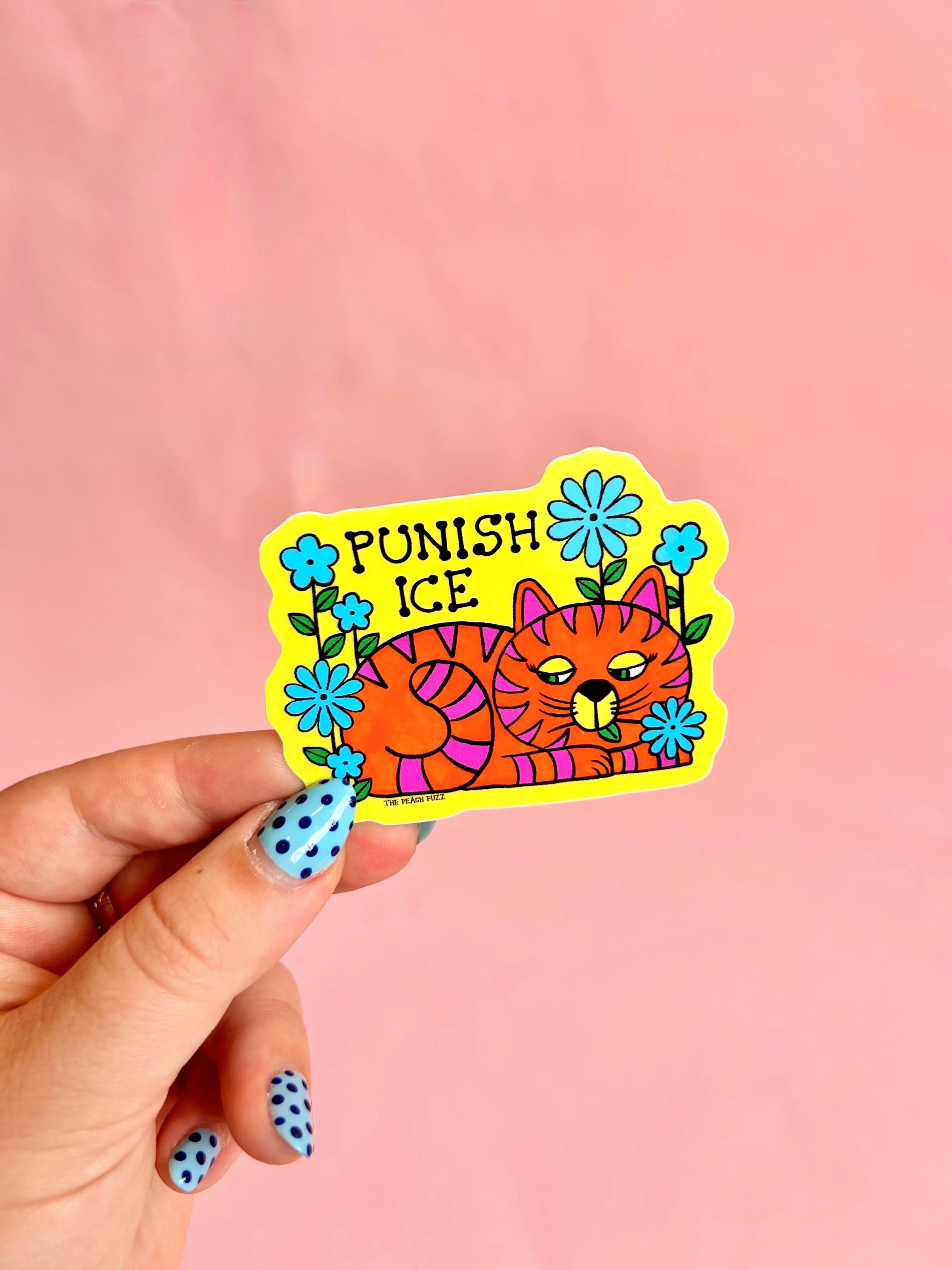 a bright orange cat with pink stripes has a blue flower in it's mouth. the text above reads "punish ice"