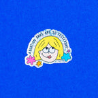 A vinyl sticker with glitter detail, featuring an illustration of a character with blonde hair, and the text 'Abortion bans are so yesterday’. - The Peach Fuzz